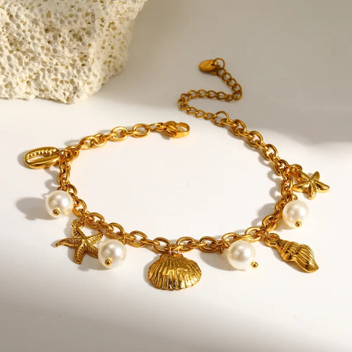 Elegant bracelet with pearls and marine symbols, 18K gold plated, with seashell and starfish design